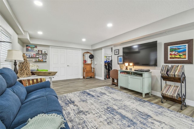 1326 Apollo Beach Blvd S, Apollo Beach, FL 33572 - living room with baseboards, recessed lighting, and light wood-style flooring