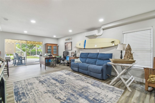 1326 Apollo Beach Blvd S, Apollo Beach, FL 33572 - living area with recessed lighting, a wall mounted AC, and wood finished floors