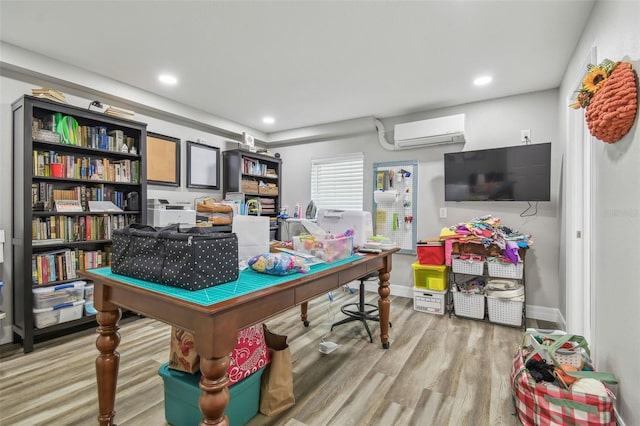 1326 Apollo Beach Blvd S, Apollo Beach, FL 33572 - rec room featuring an AC wall unit, baseboards, recessed lighting, and wood finished floors