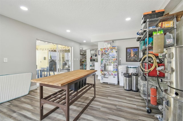 1326 Apollo Beach Blvd S, Apollo Beach, FL 33572 - dining space featuring radiator heating unit, recessed lighting, and wood finished floors