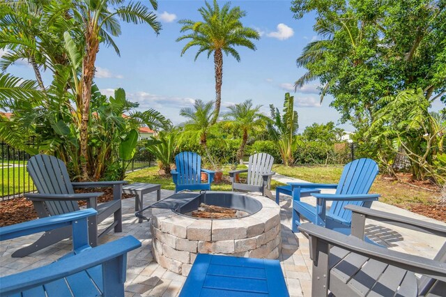 1326 Apollo Beach Blvd S, Apollo Beach, FL 33572 - view of patio with fence and a fire pit