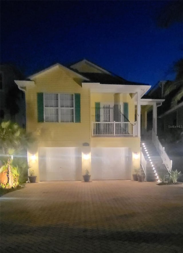 1326 Apollo Beach Blvd S, Apollo Beach, FL 33572 - bungalow-style home with an attached garage, decorative driveway, and stairway