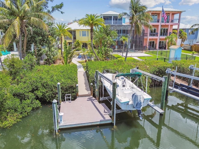 1326 Apollo Beach Blvd S, Apollo Beach, FL 33572 - view of dock with a water view, a yard, fence, and boat lift
