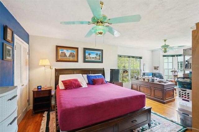 bedroom with wood finished floors and a ceiling fan