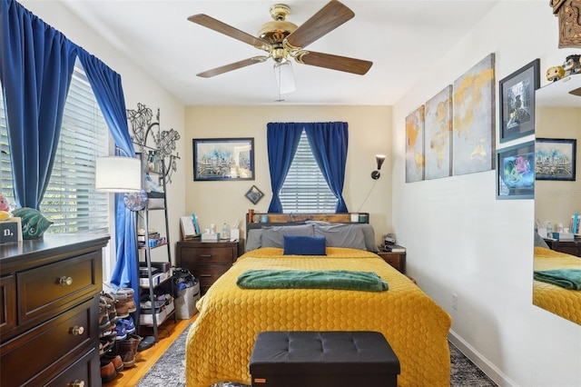 bedroom featuring a ceiling fan and wood finished floors