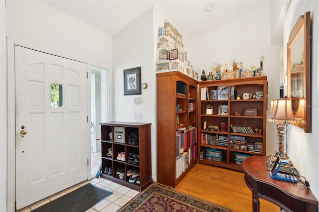 foyer featuring light tile patterned flooring
