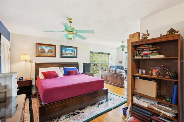 bedroom featuring a ceiling fan and wood finished floors