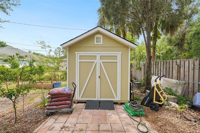 view of shed with a fenced backyard