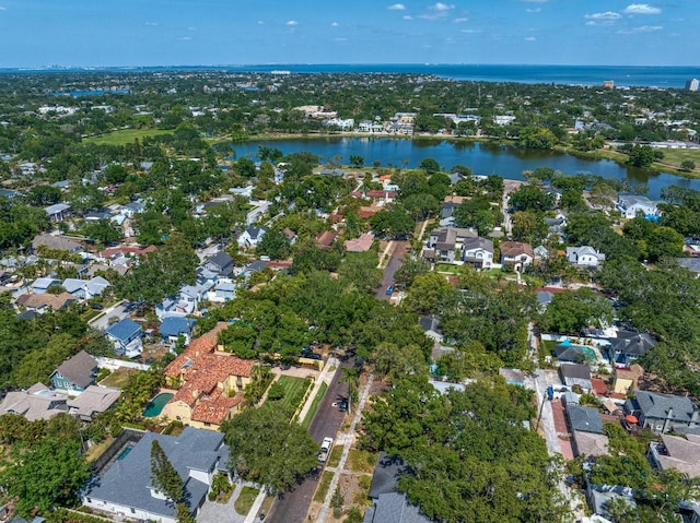 drone / aerial view with a water view and a residential view