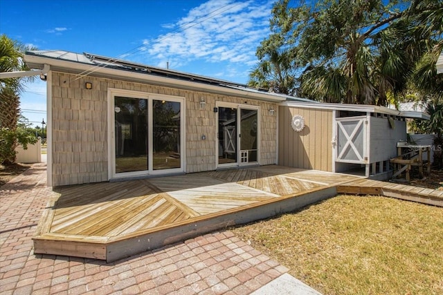 2728 58th St S, Gulfport, FL 33707 - rear view of house featuring a deck