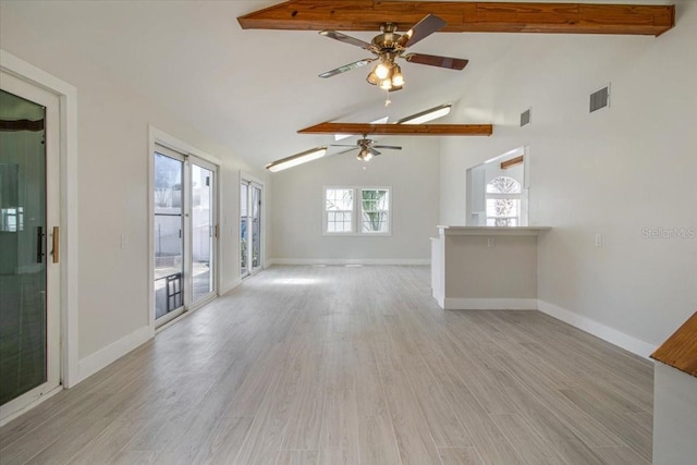 2728 58th St S, Gulfport, FL 33707 - unfurnished living room featuring ceiling fan, baseboards, and light wood-type flooring