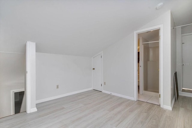 2728 58th St S, Gulfport, FL 33707 - additional living space featuring wood finished floors, lofted ceiling, and baseboards