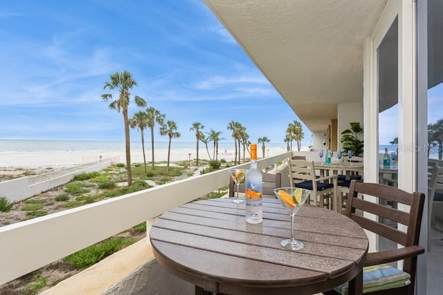 17900 Gulf Blvd Unit 1B, Redington Shores, FL 33708 - balcony with outdoor dining space and view of water and beach