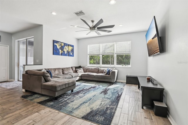 3046 Donington Castle Ln, Land O Lakes, FL 34638 - living area with ceiling fan, wood finished floors, baseboards, and recessed lighting