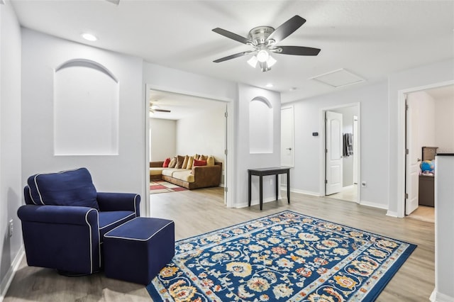 3046 Donington Castle Ln, Land O Lakes, FL 34638 - sitting room featuring wood finished floors, a ceiling fan, attic access, and recessed lighting