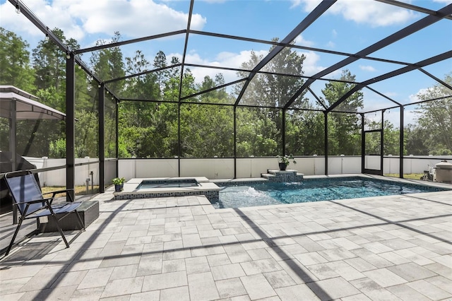 3046 Donington Castle Ln, Land O Lakes, FL 34638 - view of swimming pool with a pool with connected hot tub and a patio