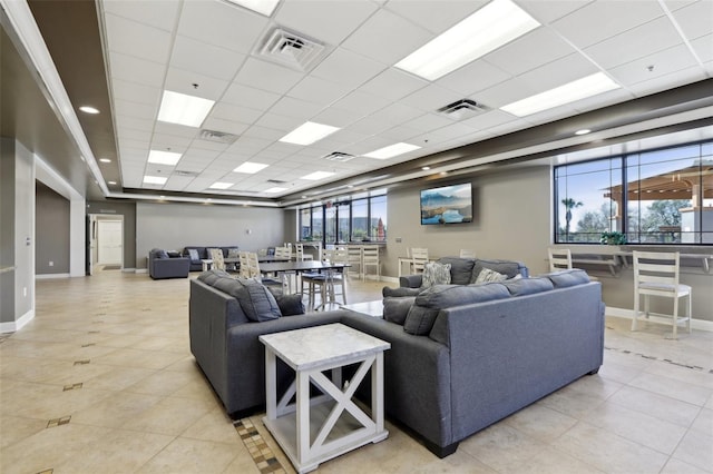 3046 Donington Castle Ln, Land O Lakes, FL 34638 - living room featuring baseboards, a paneled ceiling, and light tile patterned floors