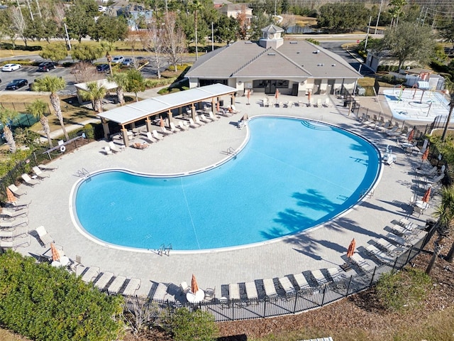 3046 Donington Castle Ln, Land O Lakes, FL 34638 - community pool featuring a patio and fence