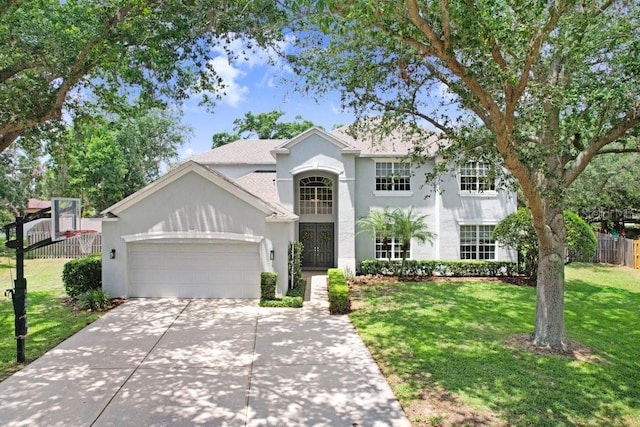 808 Hickory Glen Dr, Seffner, FL 33584 - view of front of house with an attached garage, stucco siding, and concrete driveway