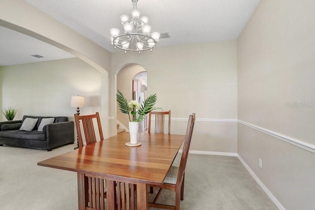 808 Hickory Glen Dr, Seffner, FL 33584 - dining space with carpet floors, arched walkways, and a chandelier