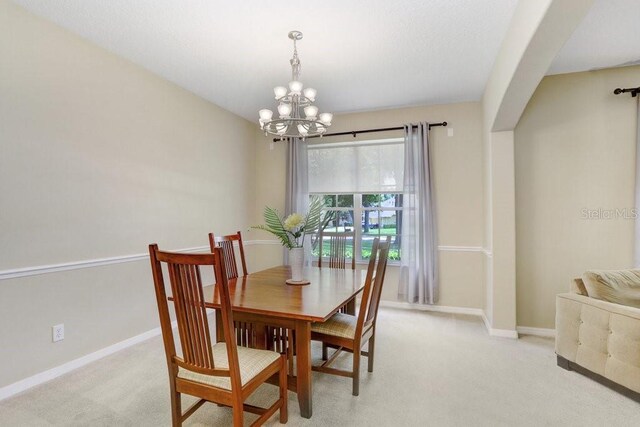 808 Hickory Glen Dr, Seffner, FL 33584 - dining area with a chandelier and light colored carpet