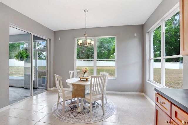 808 Hickory Glen Dr, Seffner, FL 33584 - dining space with light tile patterned floors and a chandelier