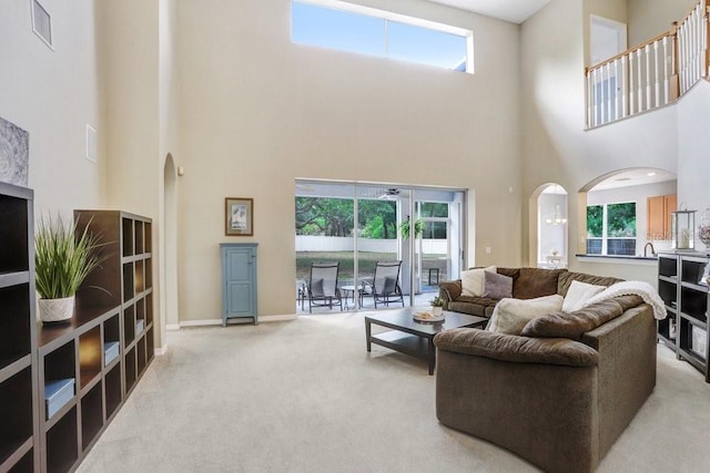 808 Hickory Glen Dr, Seffner, FL 33584 - carpeted living room with arched walkways and a towering ceiling