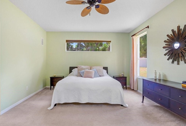 808 Hickory Glen Dr, Seffner, FL 33584 - bedroom with multiple windows, light colored carpet, and a ceiling fan