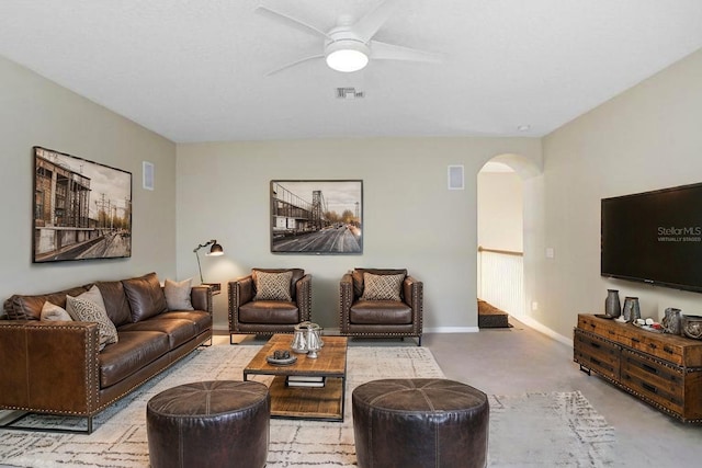 808 Hickory Glen Dr, Seffner, FL 33584 - living area featuring arched walkways, ceiling fan, and concrete floors
