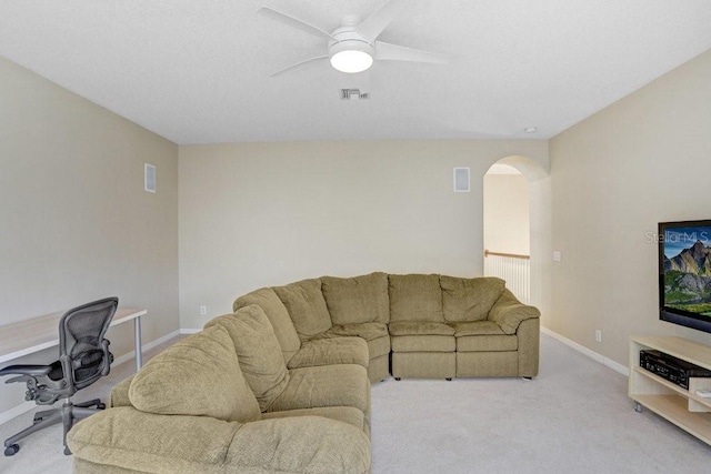 808 Hickory Glen Dr, Seffner, FL 33584 - living area featuring arched walkways, ceiling fan, light colored carpet, and a desk