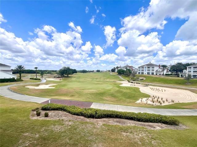7673 Heritage Crossing Way Unit 202, Reunion, FL 34747 - view of home's community with golf course view and a yard