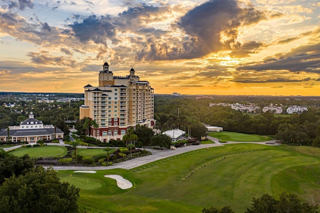 7673 Heritage Crossing Way Unit 202, Reunion, FL 34747 - aerial view at dusk featuring golf course view