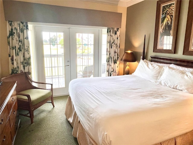 7673 Heritage Crossing Way Unit 202, Reunion, FL 34747 - carpeted bedroom featuring crown molding, access to outside, and multiple windows