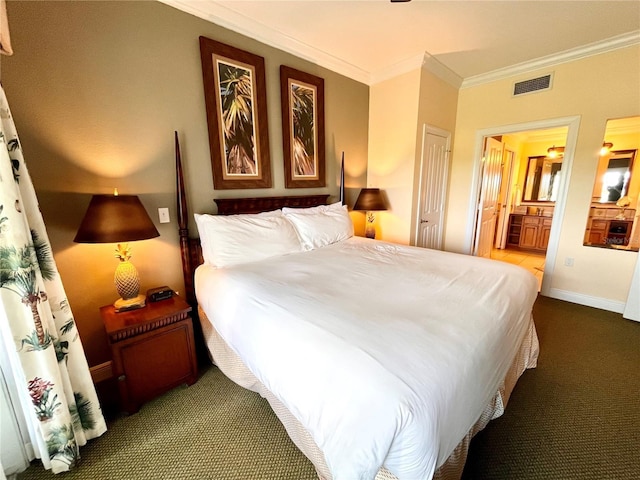 7673 Heritage Crossing Way Unit 202, Reunion, FL 34747 - bedroom featuring visible vents, crown molding, carpet floors, baseboards, and connected bathroom