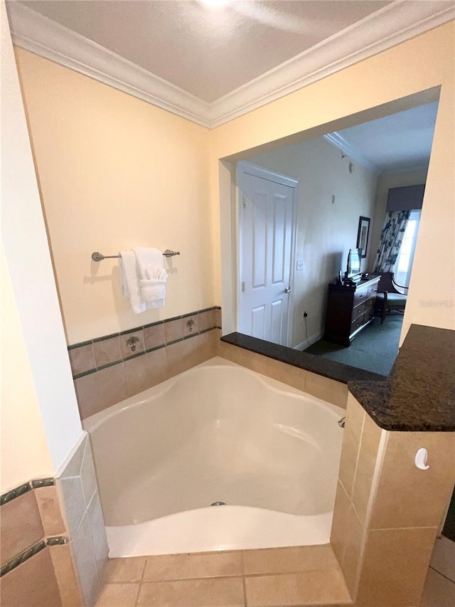 7673 Heritage Crossing Way Unit 202, Reunion, FL 34747 - full bathroom featuring tile patterned floors, ornamental molding, and a bath