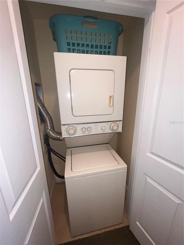 7673 Heritage Crossing Way Unit 202, Reunion, FL 34747 - laundry room with laundry area and stacked washing maching and dryer