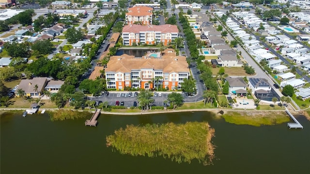 birds eye view of property featuring a residential view and a water view