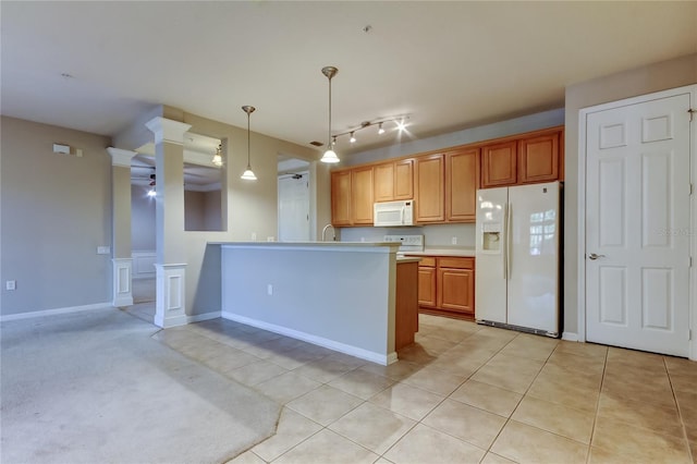 kitchen with ceiling fan, white appliances, light countertops, a peninsula, and pendant lighting