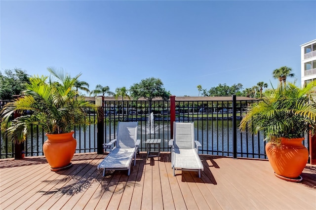deck featuring a water view