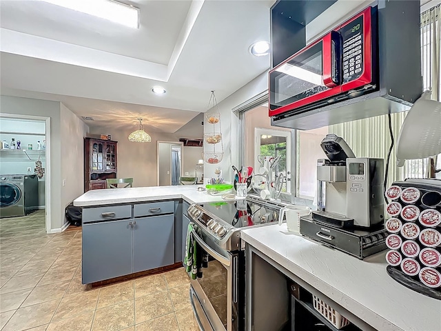 kitchen with washer / clothes dryer, light countertops, a peninsula, stainless steel electric stove, and recessed lighting