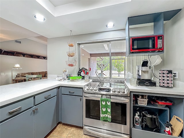 kitchen featuring visible vents, stainless steel range with electric stovetop, gray cabinetry, light countertops, and recessed lighting