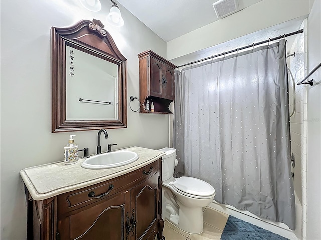 bathroom featuring vanity, tile patterned floors, visible vents, and toilet