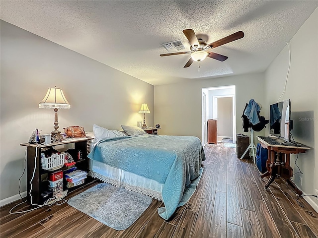 3932 Watson Dr, New Port Richey, FL 34655 - bedroom featuring a textured ceiling, visible vents, wood finished floors, and baseboards