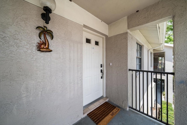 2170 Elm St Unit 906, Dunedin, FL 34698 - property entrance with stucco siding and a balcony