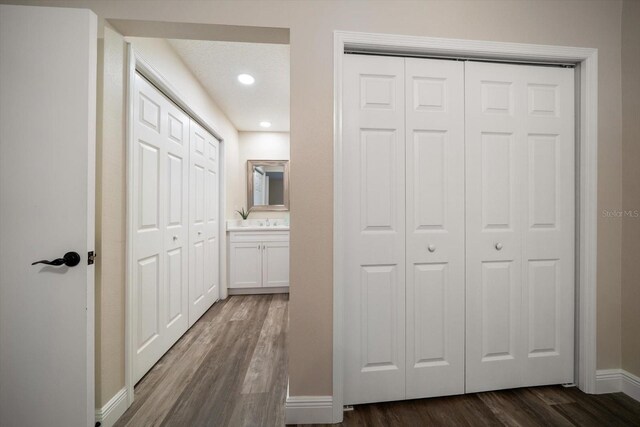 2170 Elm St Unit 906, Dunedin, FL 34698 - hallway featuring baseboards, recessed lighting, and dark wood finished floors