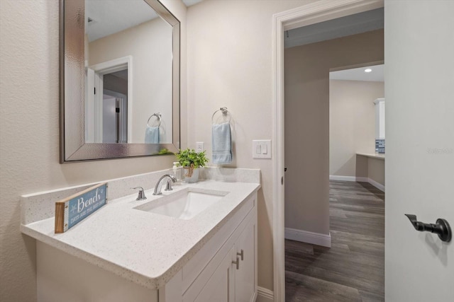 2170 Elm St Unit 906, Dunedin, FL 34698 - bathroom featuring baseboards, wood finished floors, and vanity