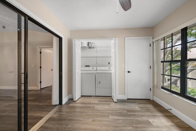2170 Elm St Unit 906, Dunedin, FL 34698 - laundry area with laundry area, ceiling fan, washer and clothes dryer, and light wood finished floors