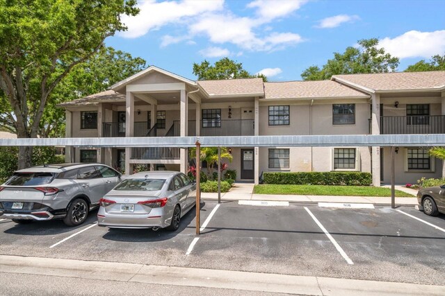 2170 Elm St Unit 906, Dunedin, FL 34698 - view of building exterior with uncovered parking