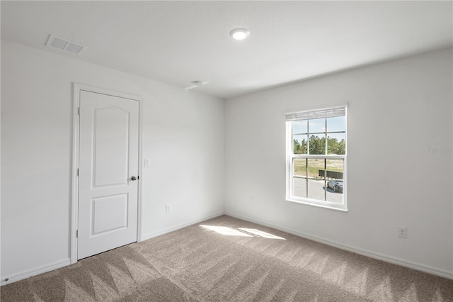 587 Bay Leaf Dr, Poinciana, FL 34759 - carpeted spare room with baseboards and visible vents