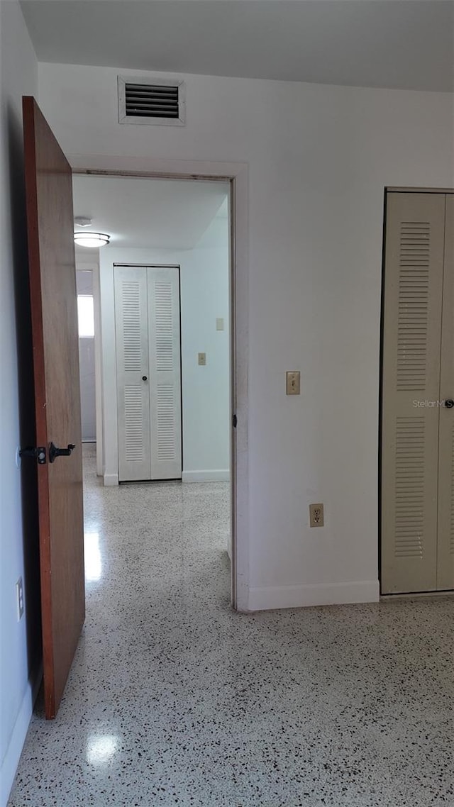 2921 SW 10th St Unit 23, Miami, FL 33135 - hall featuring speckled floor and baseboards